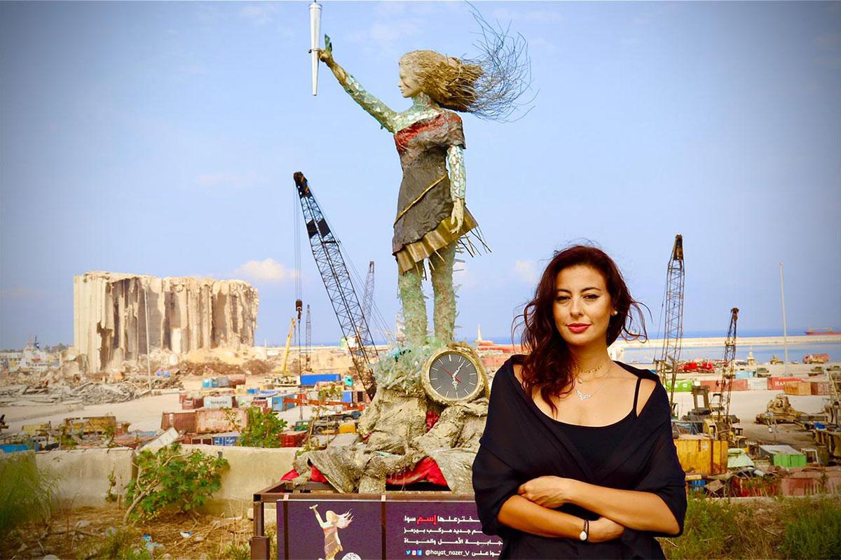 photo of alumna Hayat Nazer and her sculpture